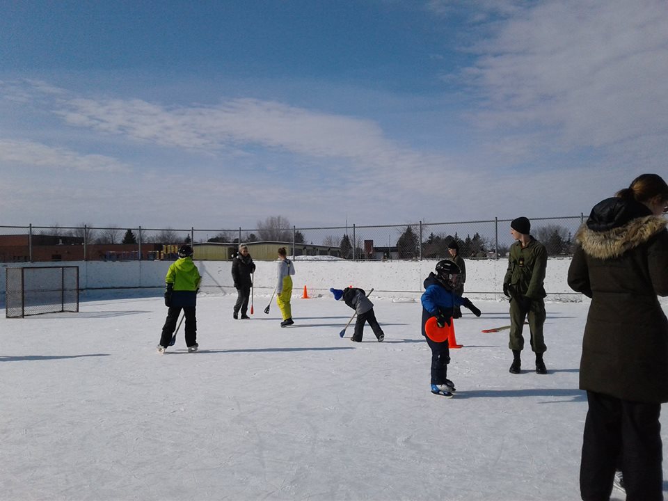 A photo of community members using the outdoor rink
