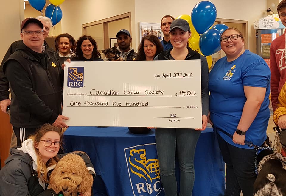 Image of group of RBC Staff and community members with large cheque in the amount of $1500 (approximate amount raised)