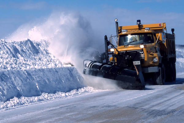 image of a snowplow pushing snow