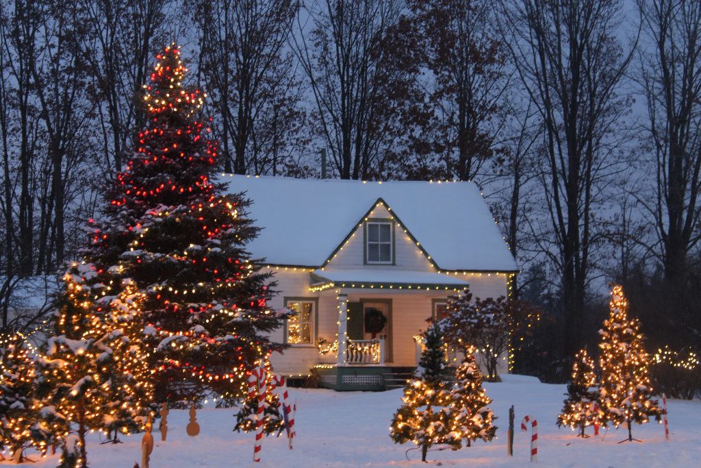 image of the Cumberland Museum with Christmas lights decorating the house and trees