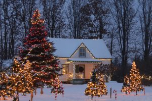 A winter photo of a home with holiday lights making it feel warm and cozy.