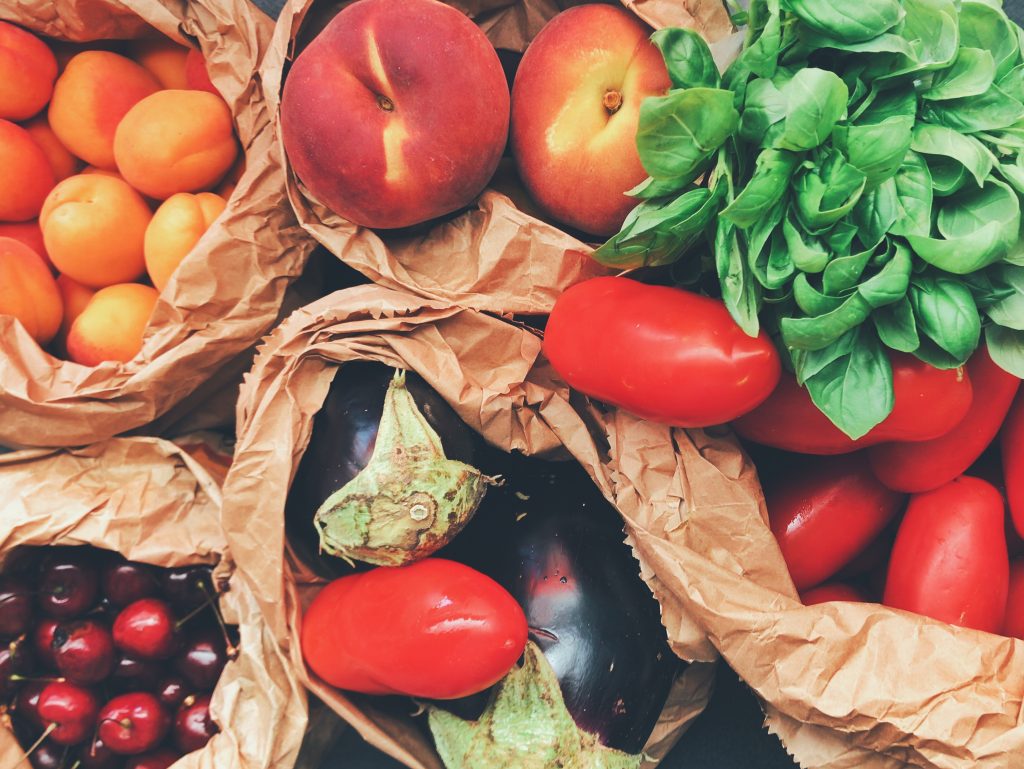 image of fruits and vegetables in paper bags