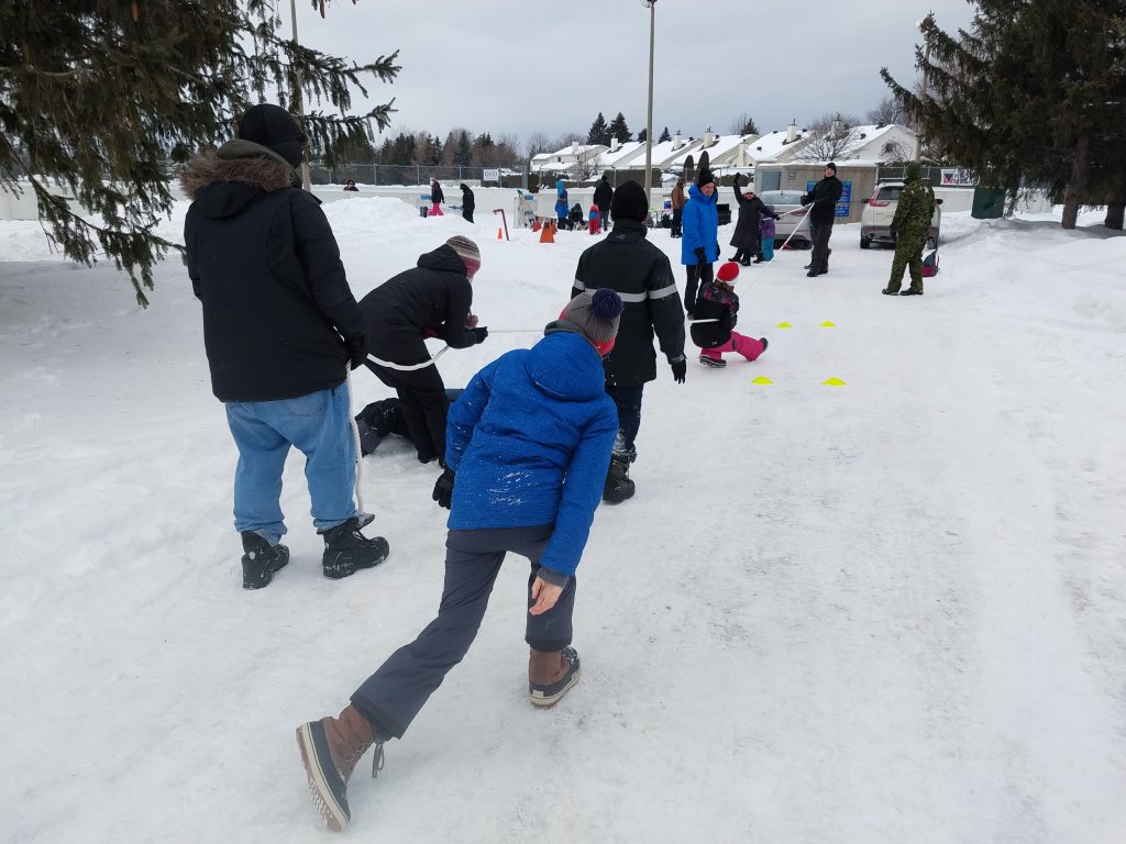 People playing a game at the 2019 winter carnival.