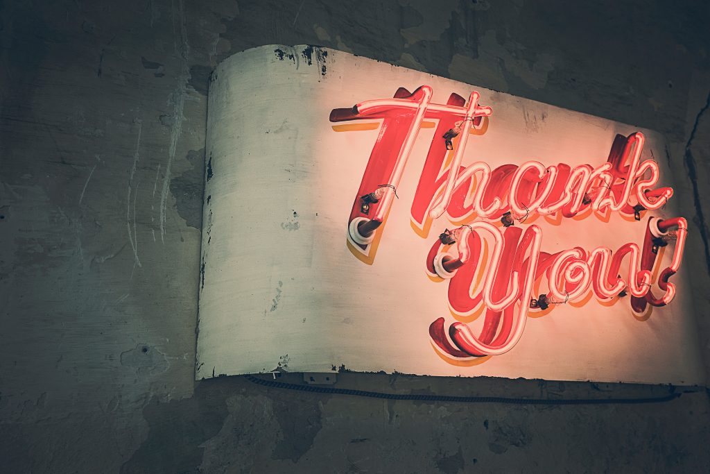 neon sign saying thank you