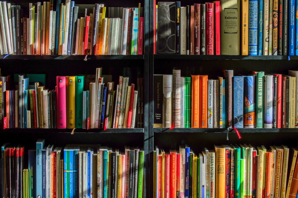 image of colourful books on bookshelves