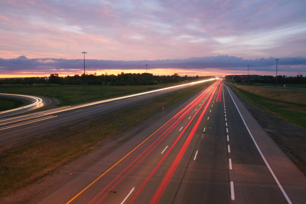 highway with blurred headlights and tail lights