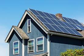 a photograph of a home with solar panels on the roof