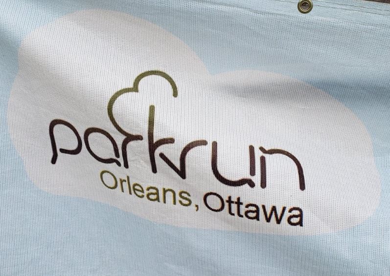 Banner with Parkrun logo - light blue background and logo inside of a white cloud.